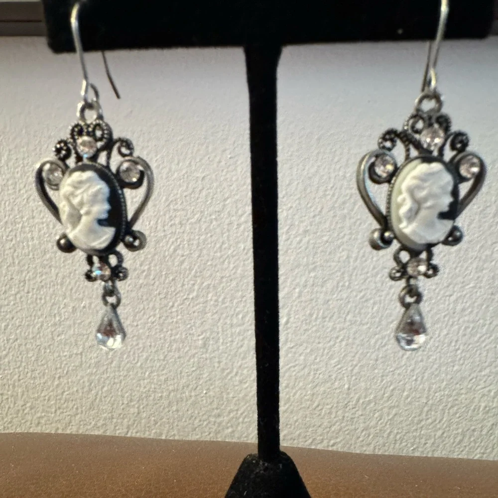 Silver tone cameo drop earrings with rhinestones
